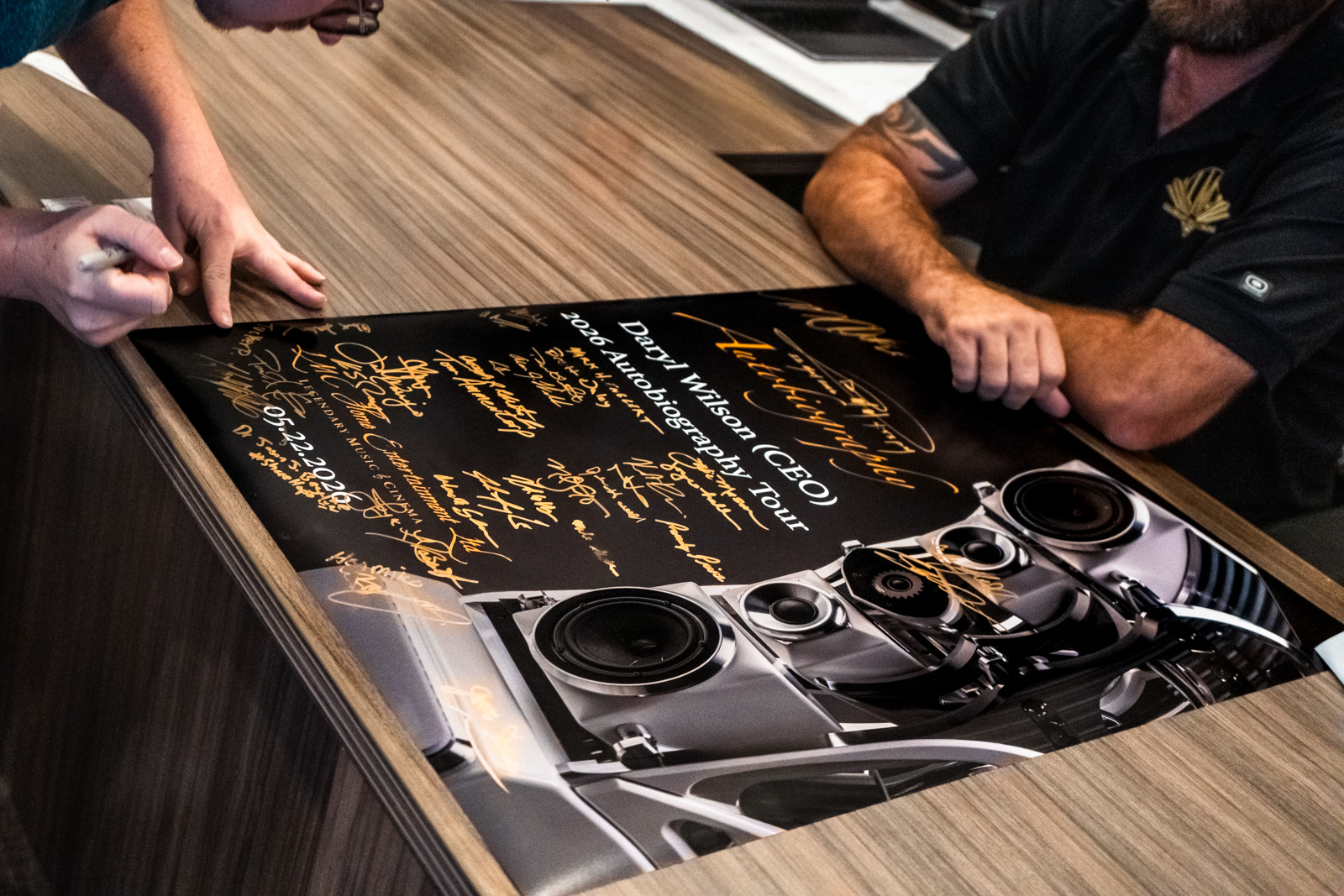 Daryl Wilson signing the Autobiography commemorative poster at LMC Scottsdale