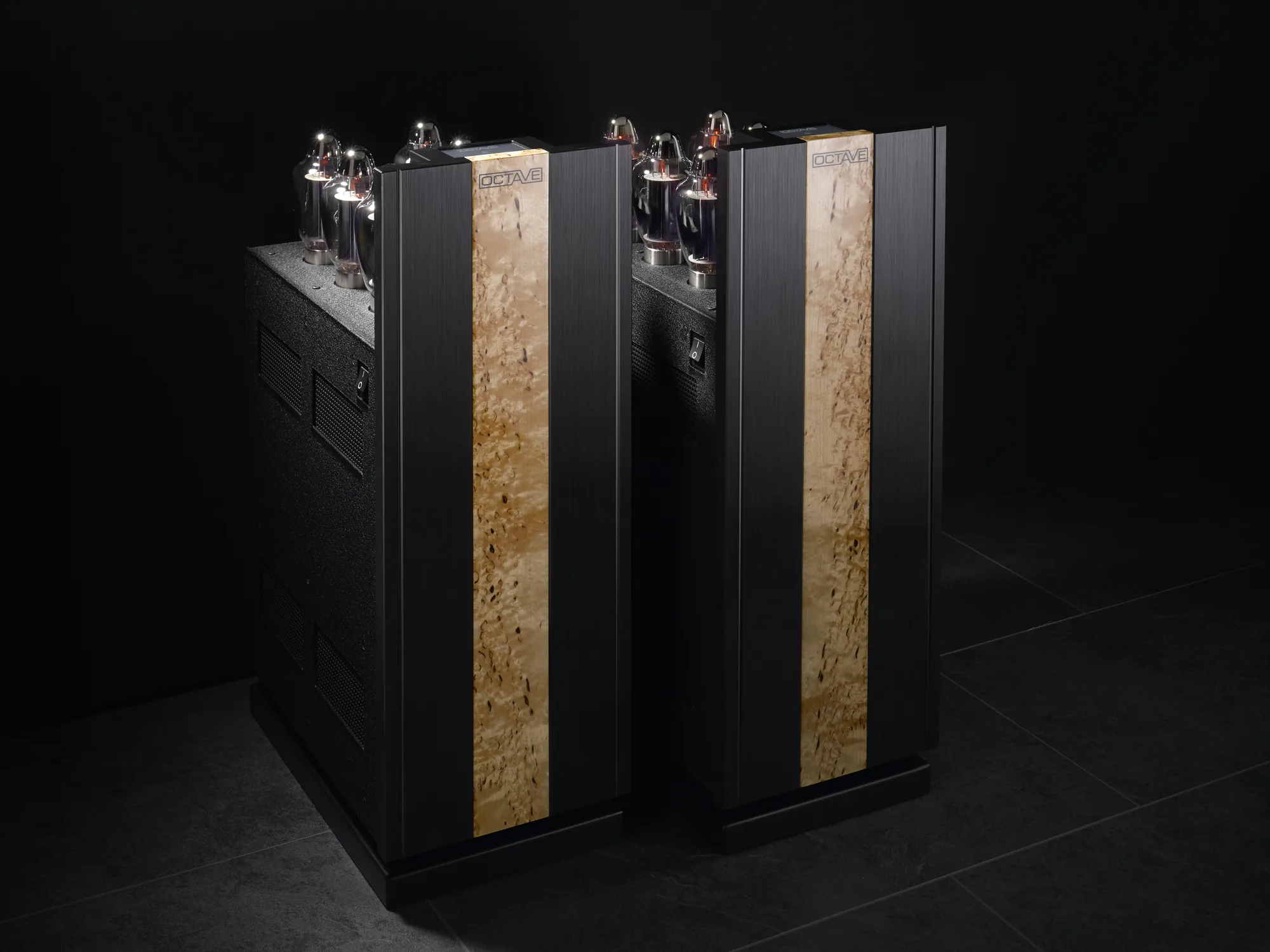 Octave Jubilee Class A monoblock amplifiers, pair in black with birch inlays on a dark ground