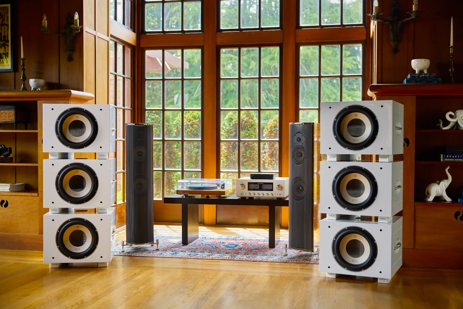 REL Acoustics S/850 subwoofers stacked in a Line Array in a white-finish room