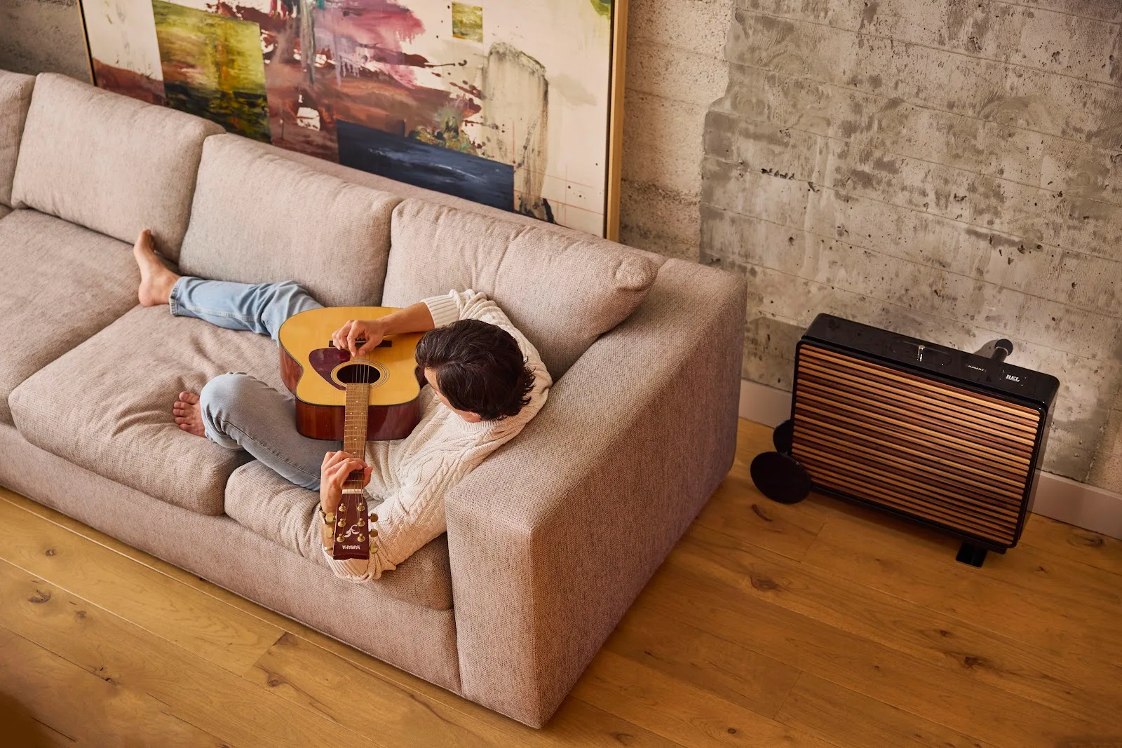 REL Planar PL-2 on the optional Planar Cart beside a sofa, wood grille fitted