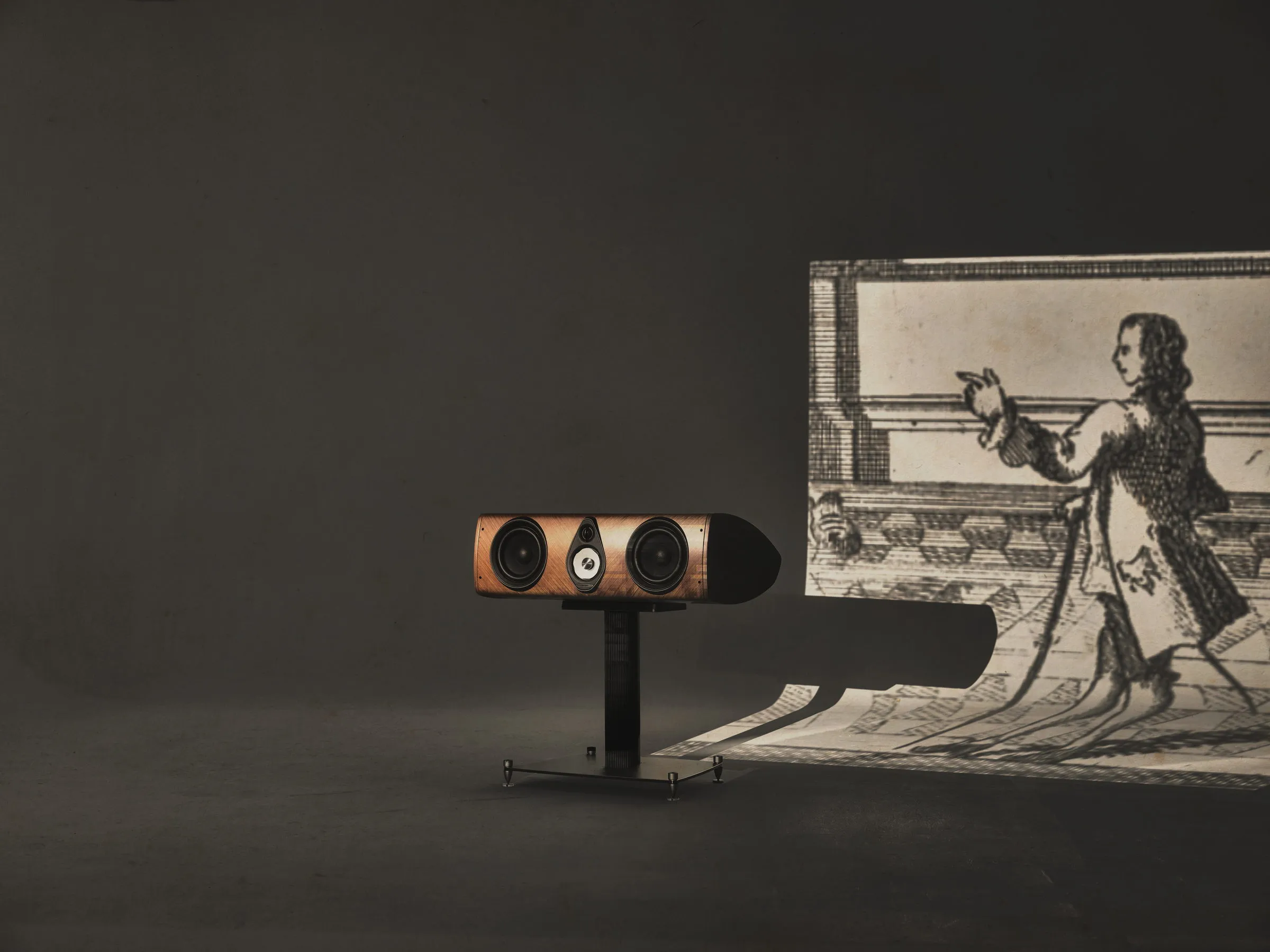 Sonus faber Olympica G3 Center channel loudspeaker on its stand, staged with a Palladian engraving