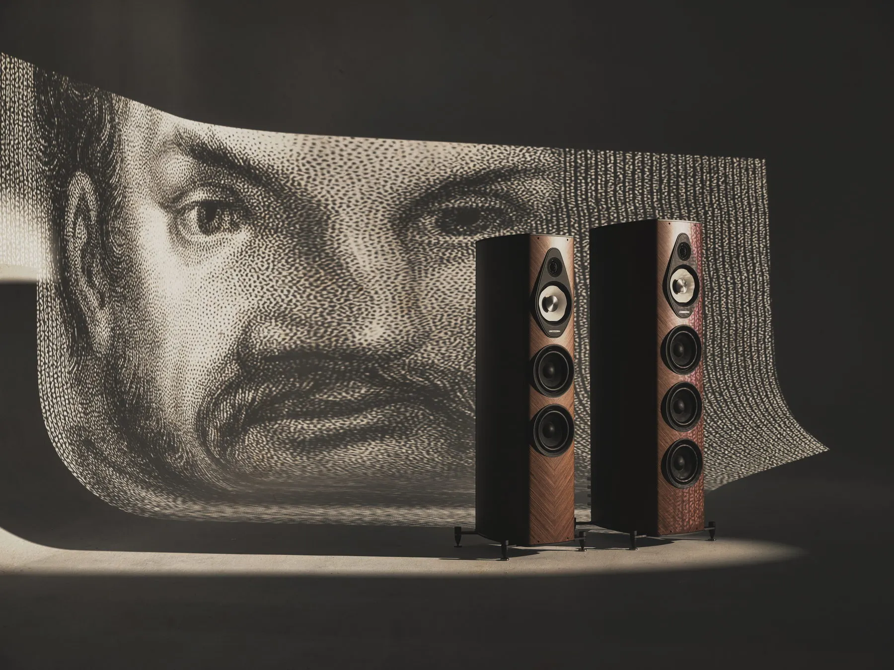 Pair of Sonus faber Olympica G3 III loudspeakers in walnut with a Palladio portrait engraving behind