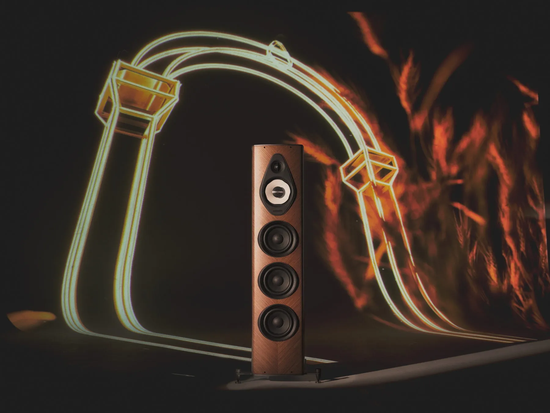 Sonus faber Olympica G3 V in walnut with a light-trail motif behind it