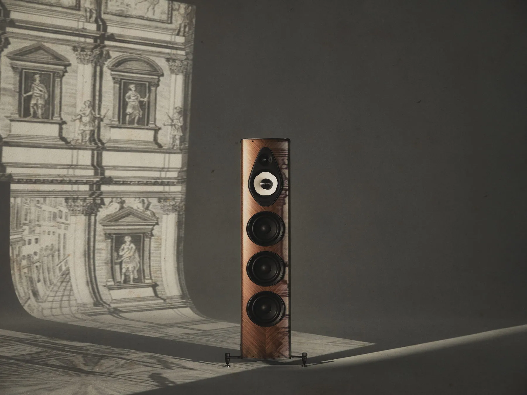 Sonus faber Olympica G3 V in walnut against a Palladian façade engraving