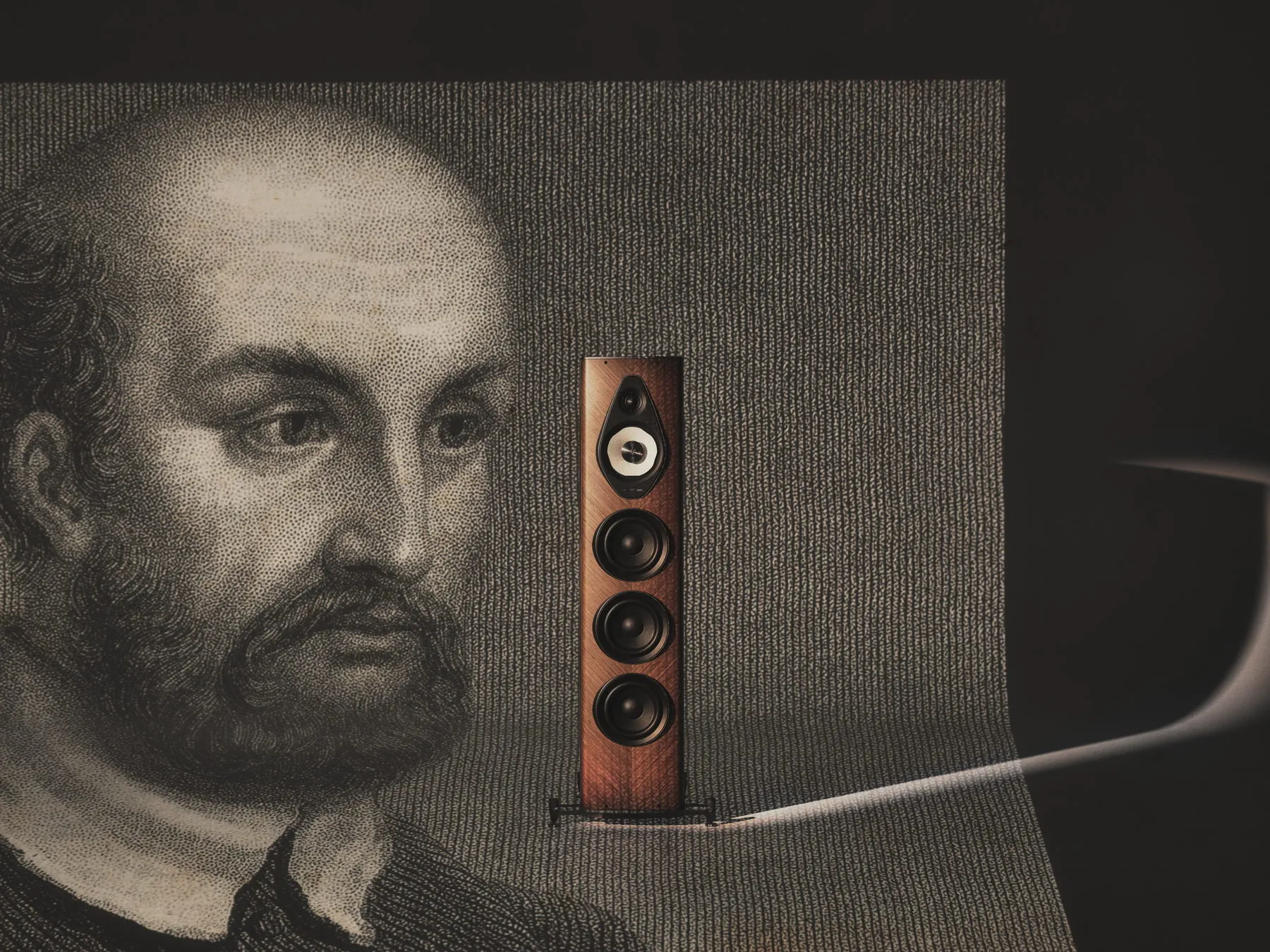 Sonus faber Olympica G3 V in walnut beside a portrait engraving of Andrea Palladio