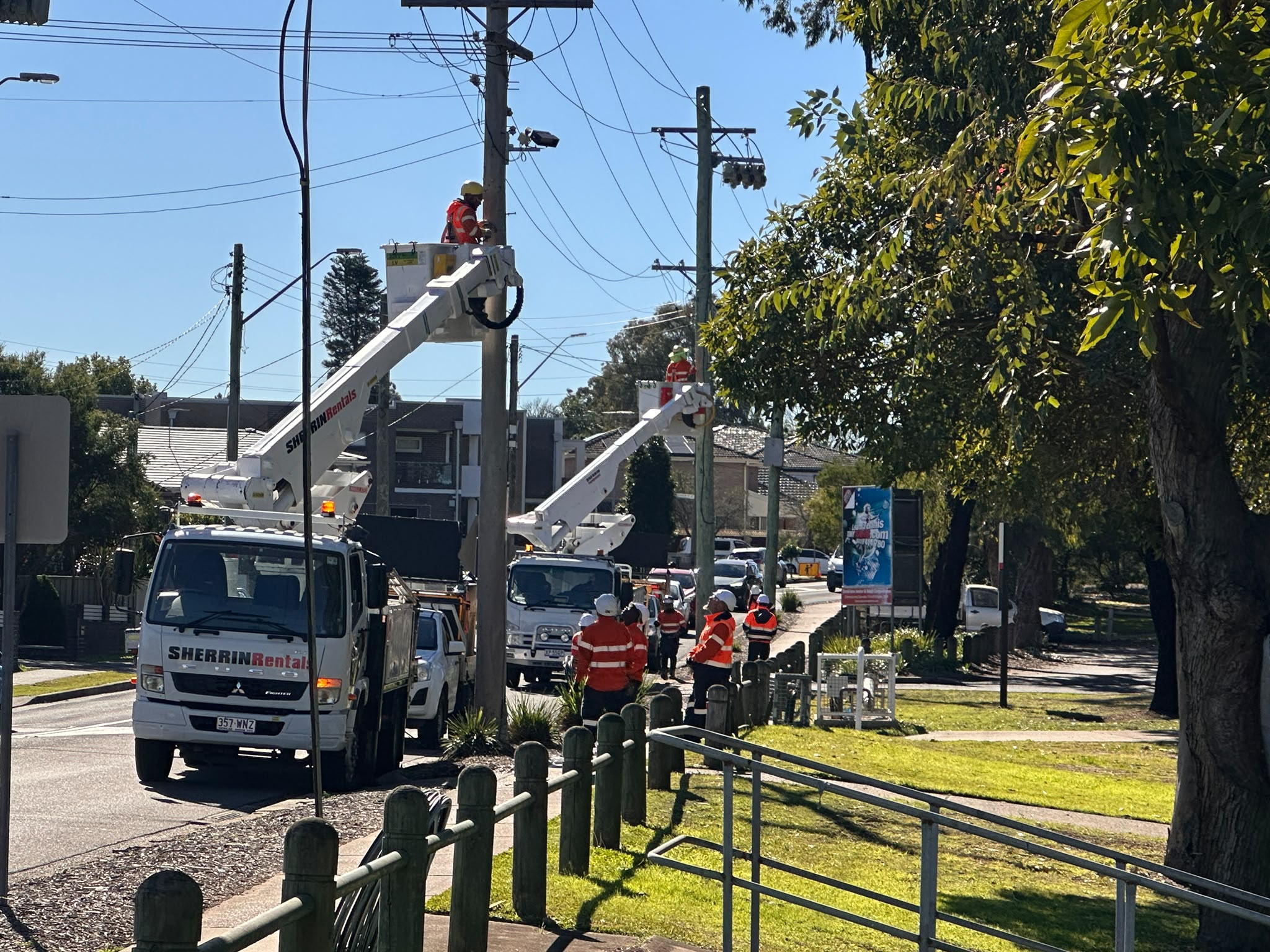 General Direct Solutions crews working on power poles from elevated work platforms