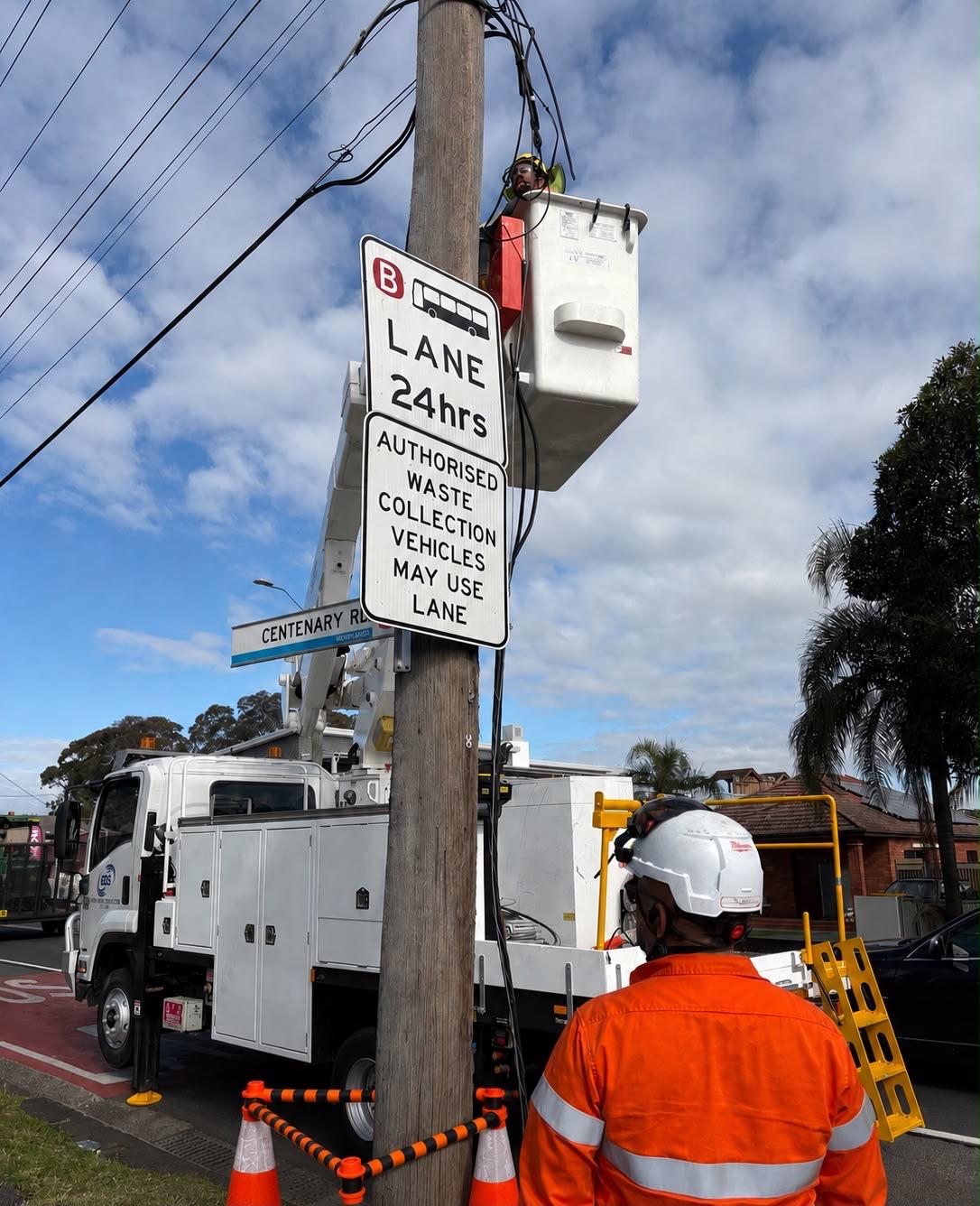 General Direct Solutions technician working from an elevated platform on a power pole