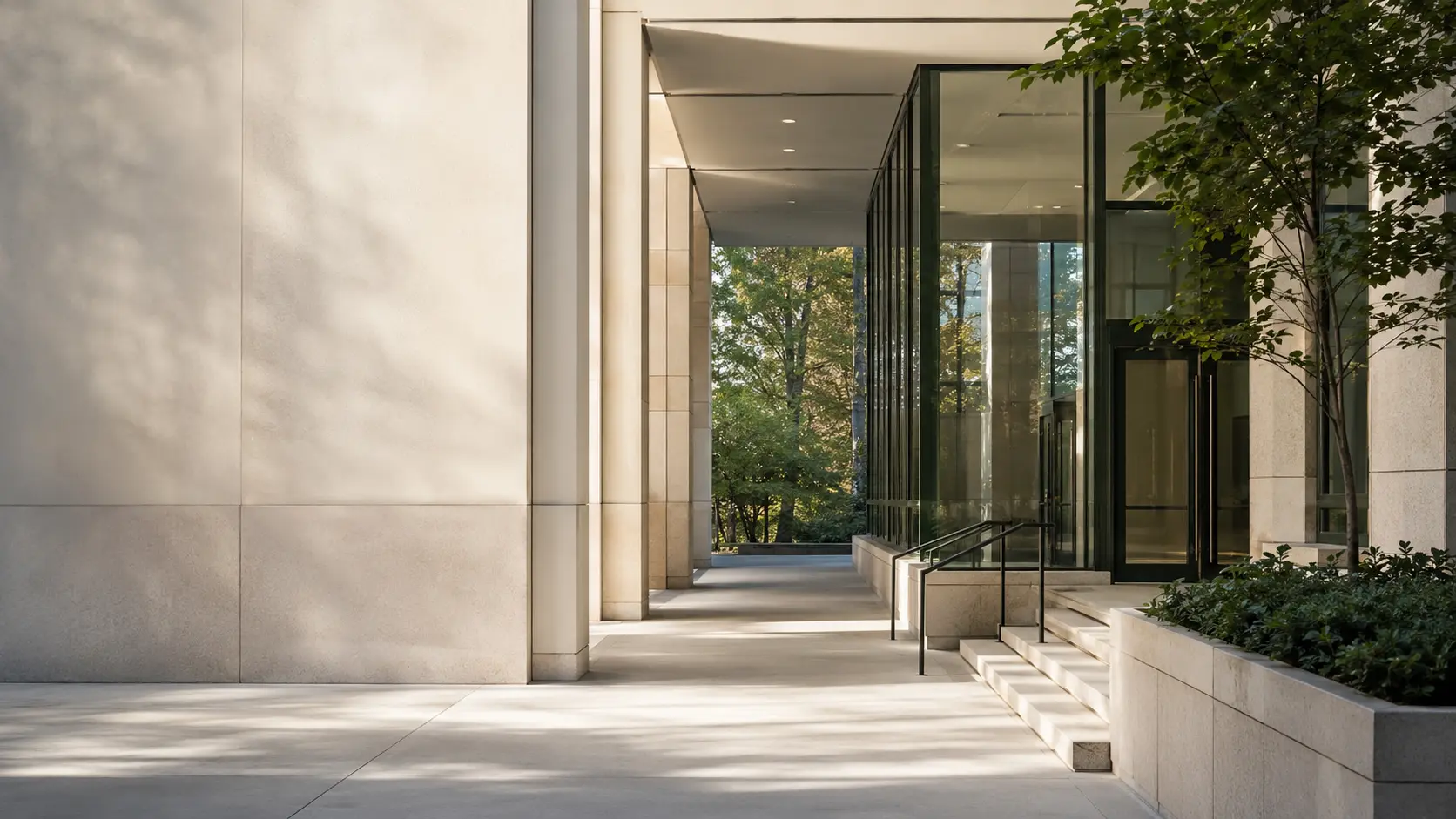 Sunlit limestone architecture and a quiet garden entrance