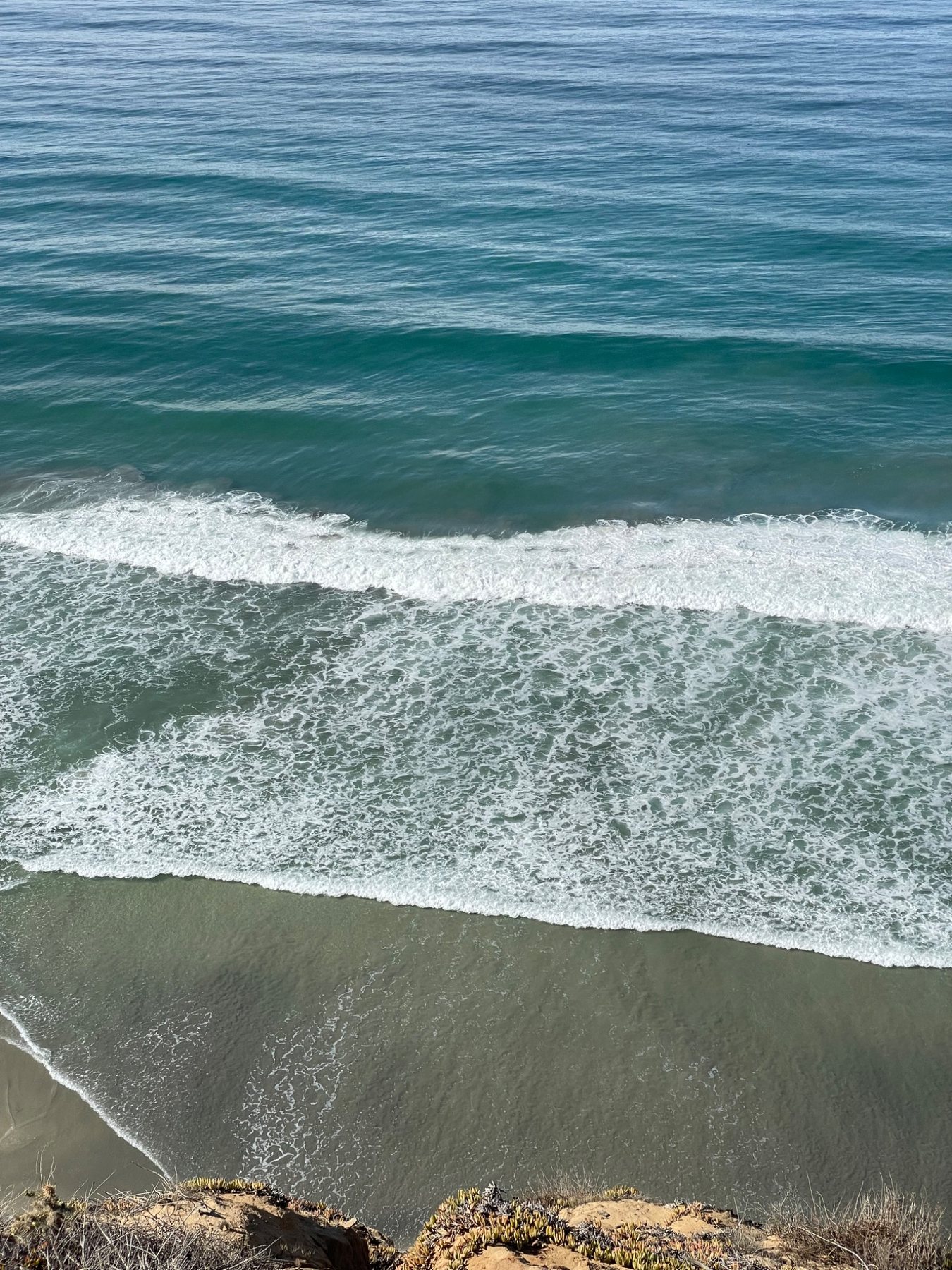 Layered ocean waves viewed from above