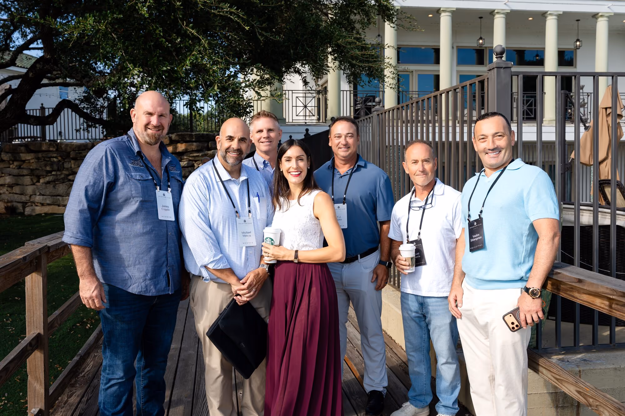 Members talking on the terrace at an Inflection Club event
