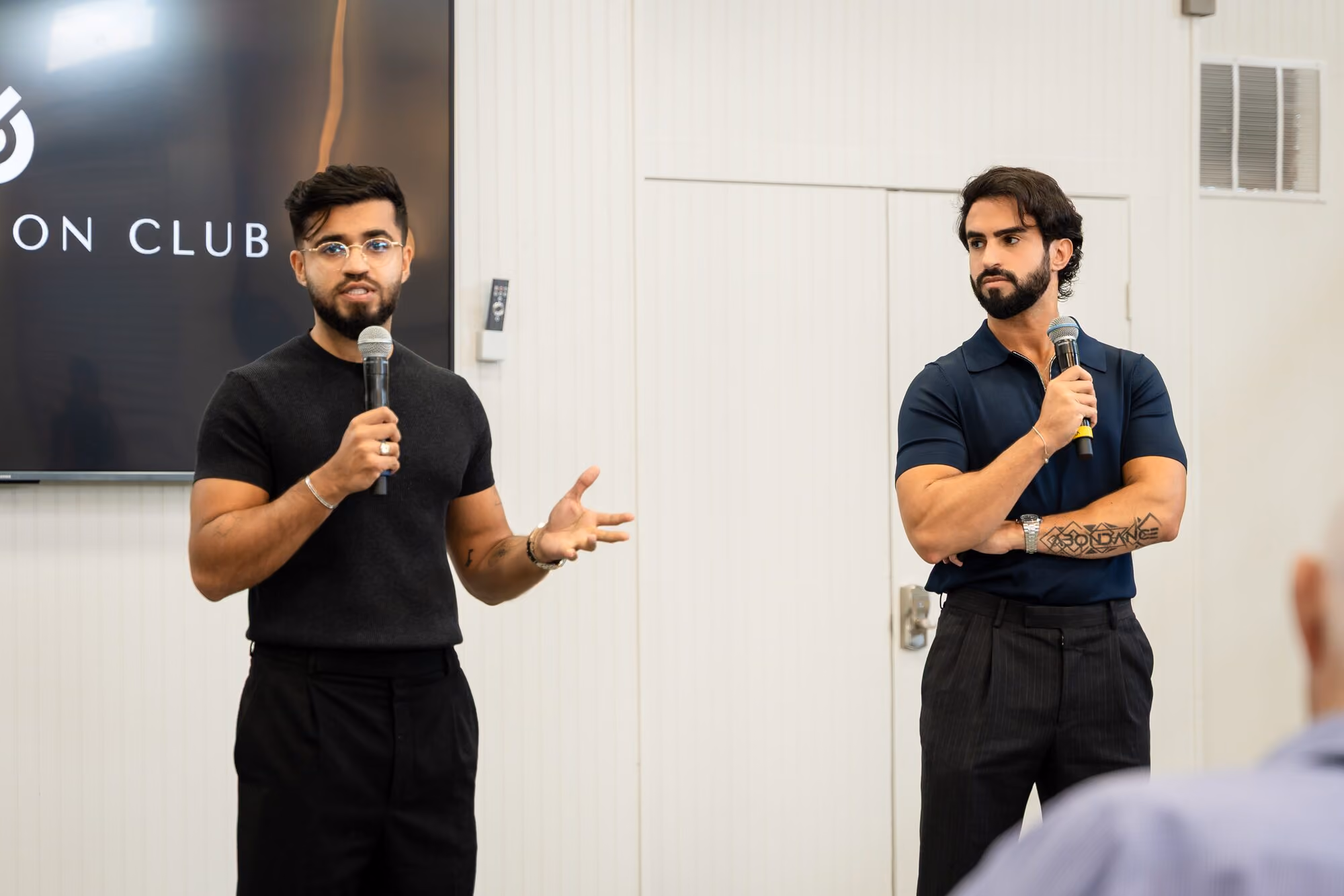 Speakers addressing members in the main room