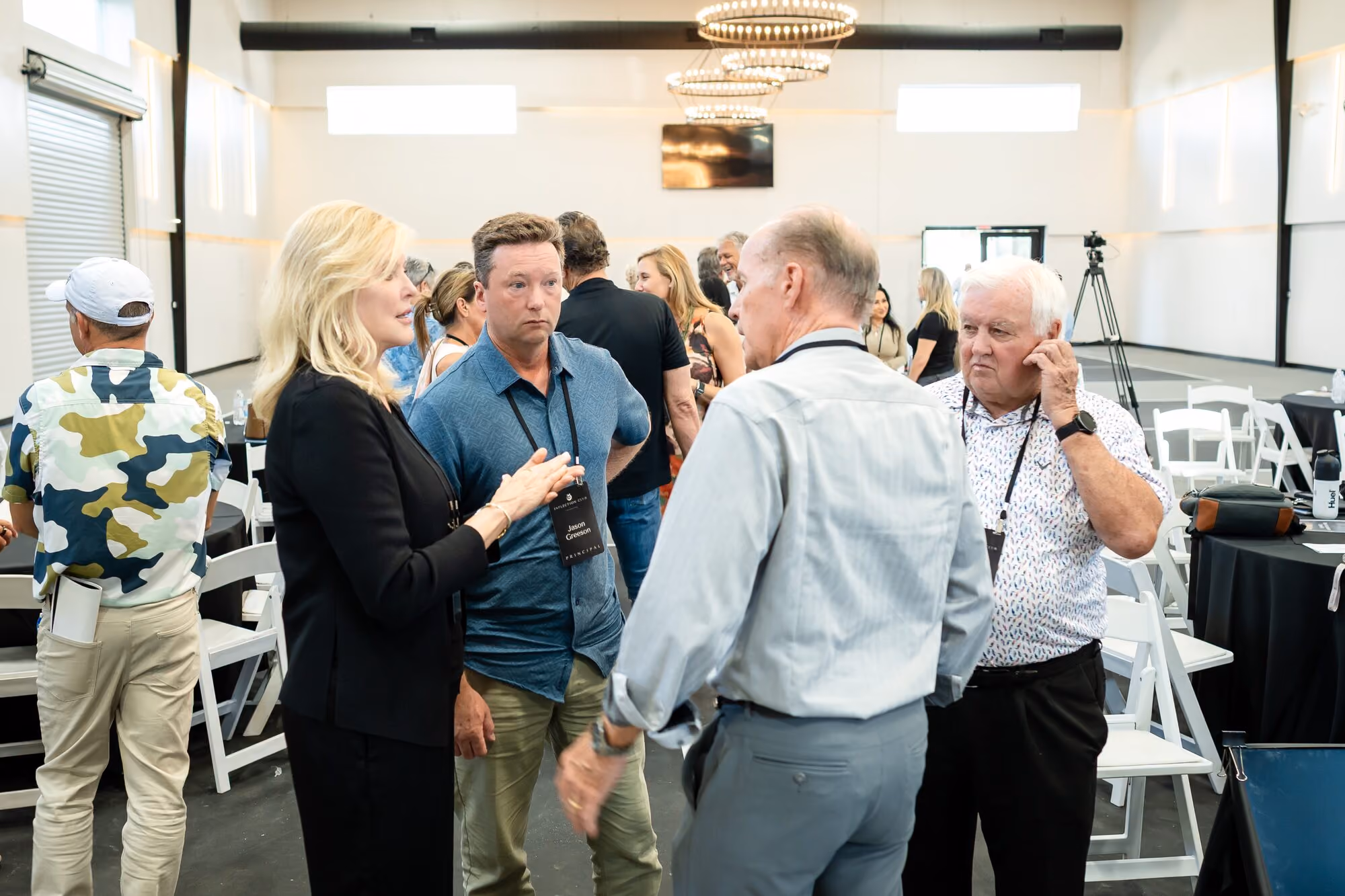 Members talking during a break at an Inflection Club event