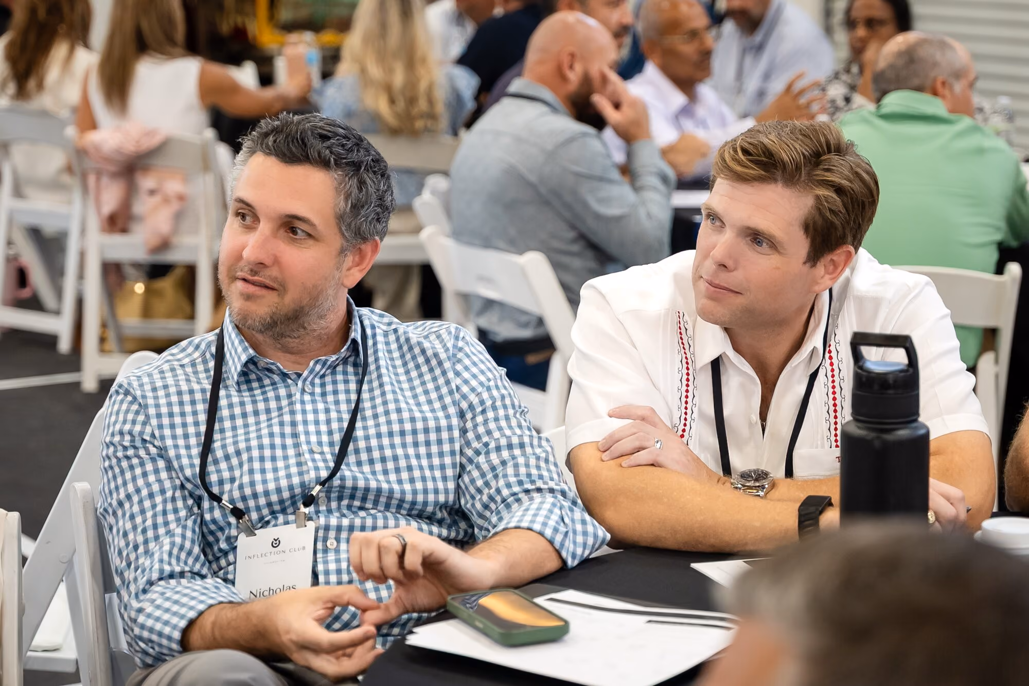Two members in conversation at their table