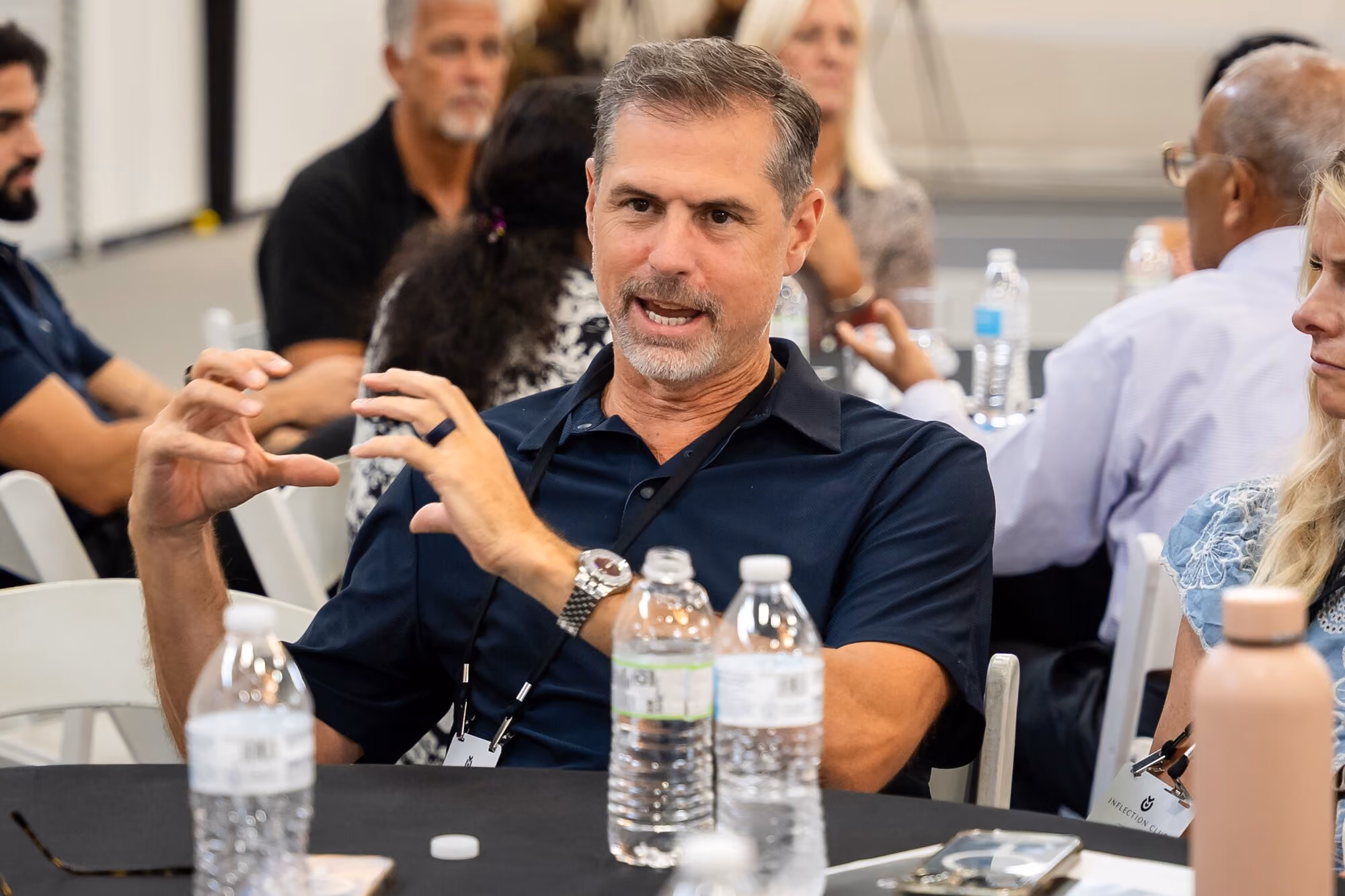 A member making a point at his table