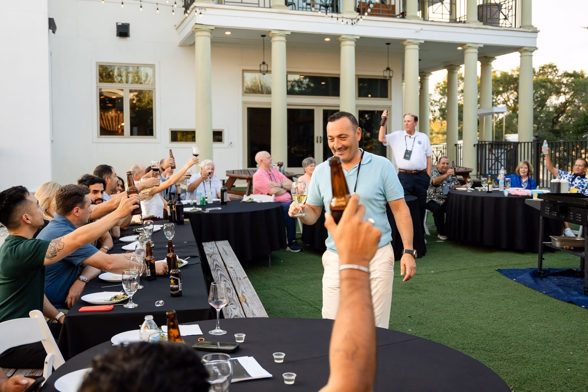 A toast down the long table at the members dinner