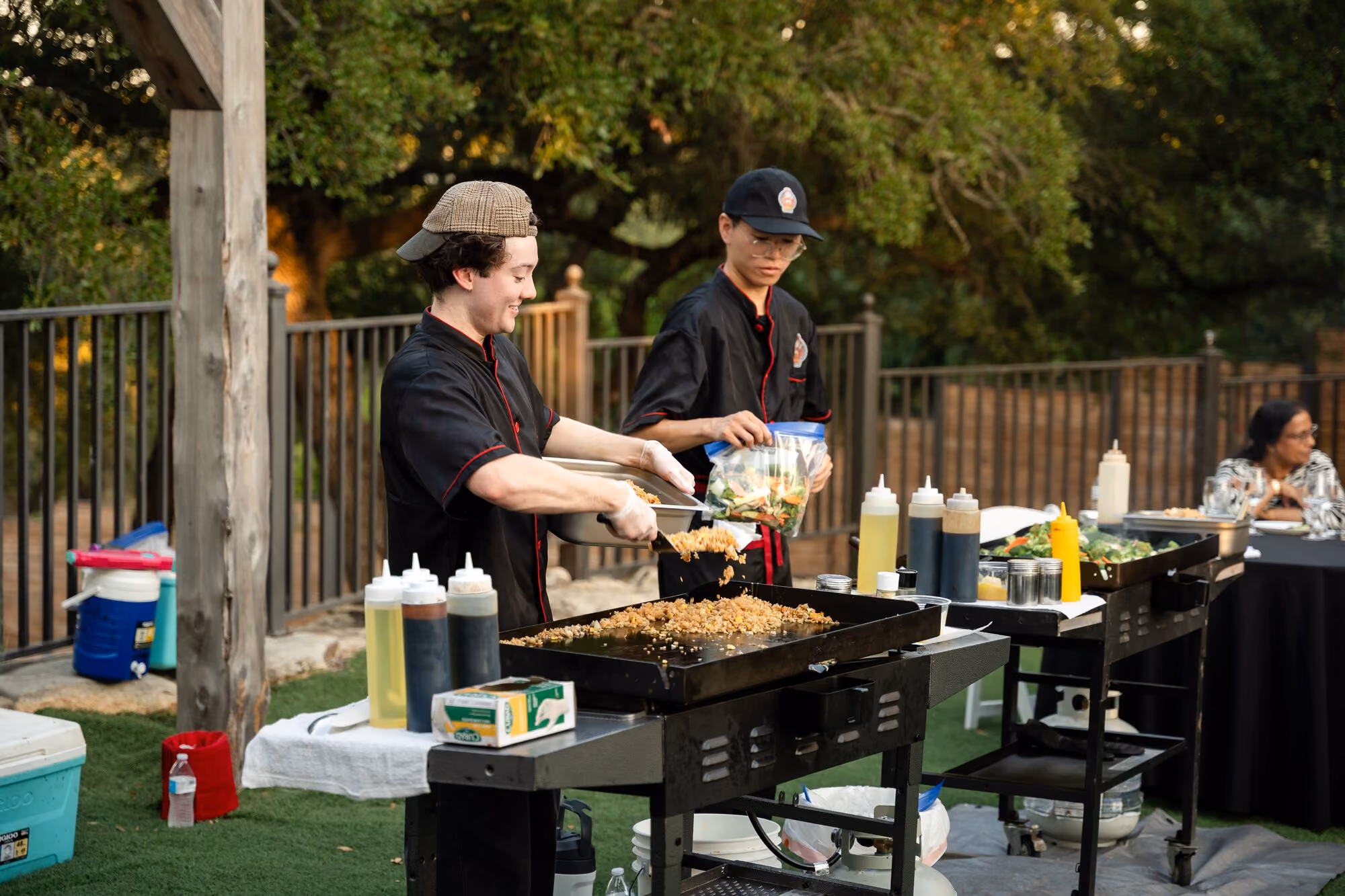 Chefs cooking at the outdoor station during the members dinner
