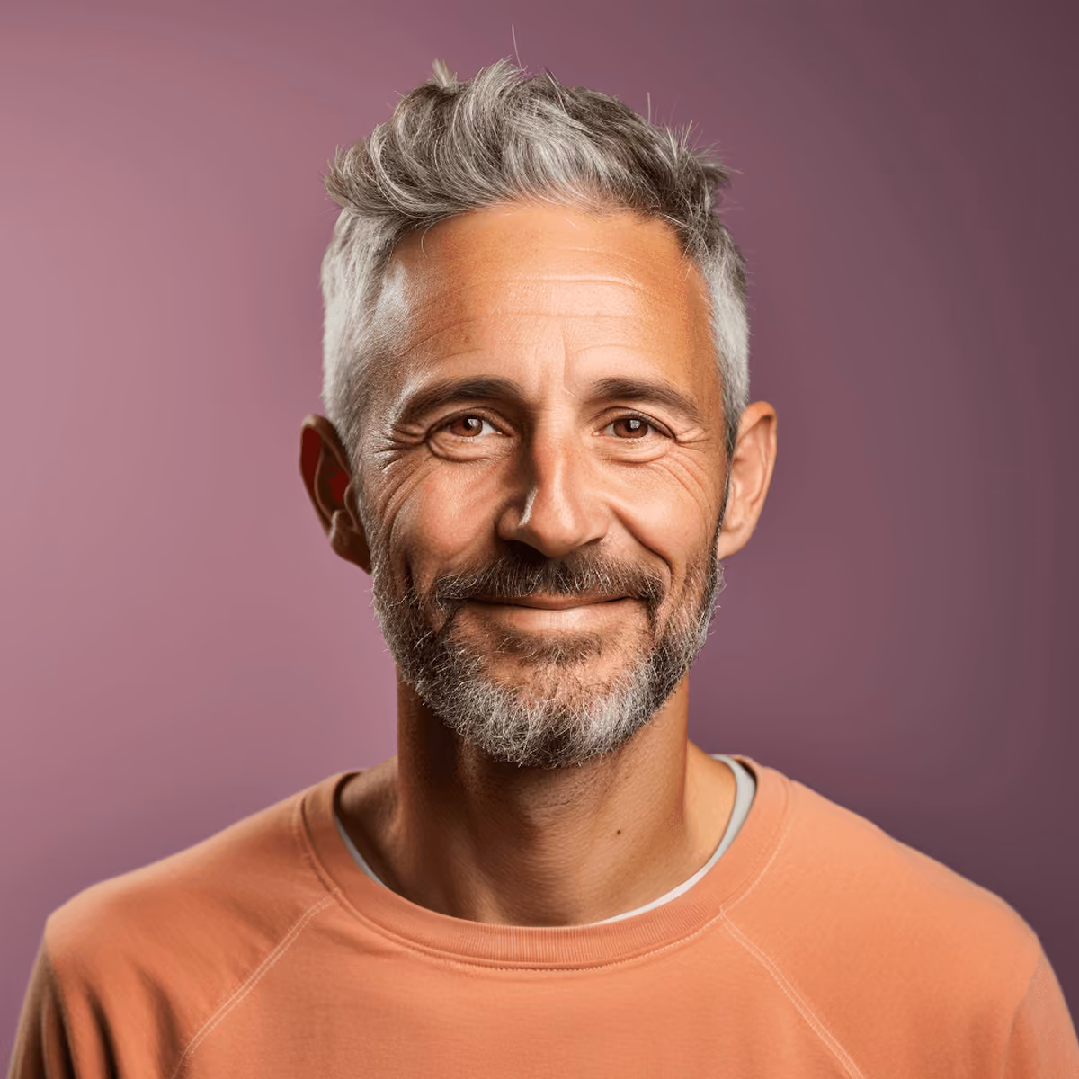 Smiling client in a peach sweatshirt