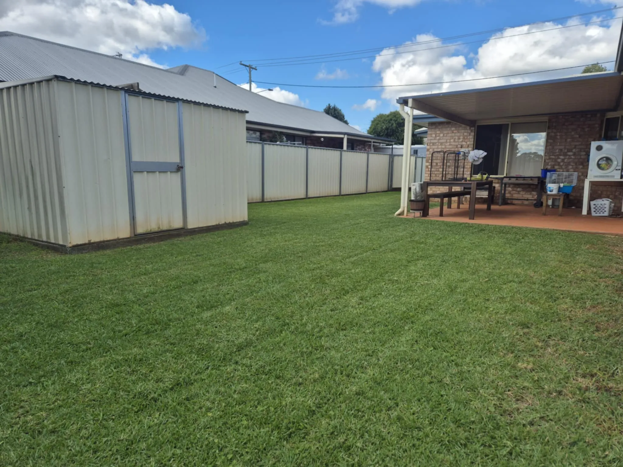 Freshly mowed lawn with a striped finish by TopLawn
