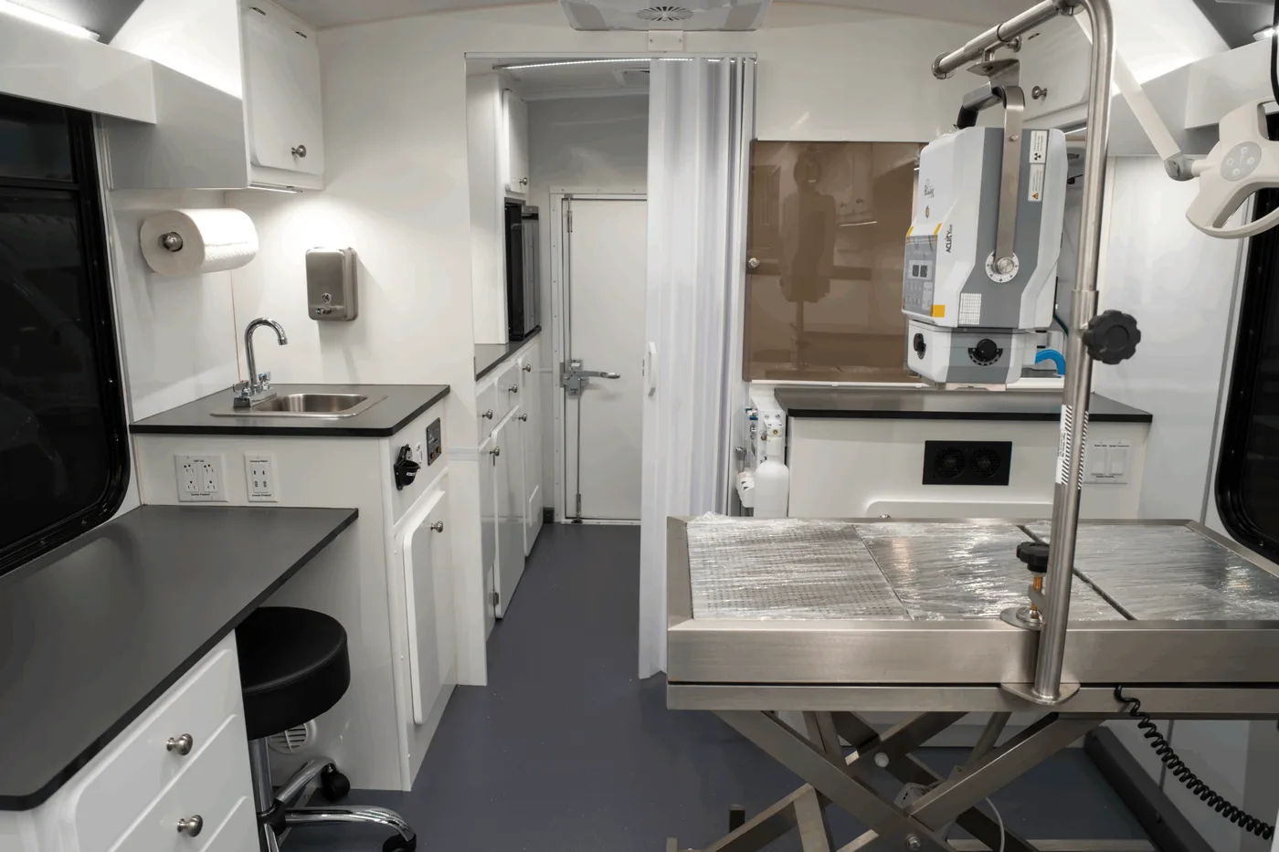Interior of The Ark showing the exam table, sink and cabinetry