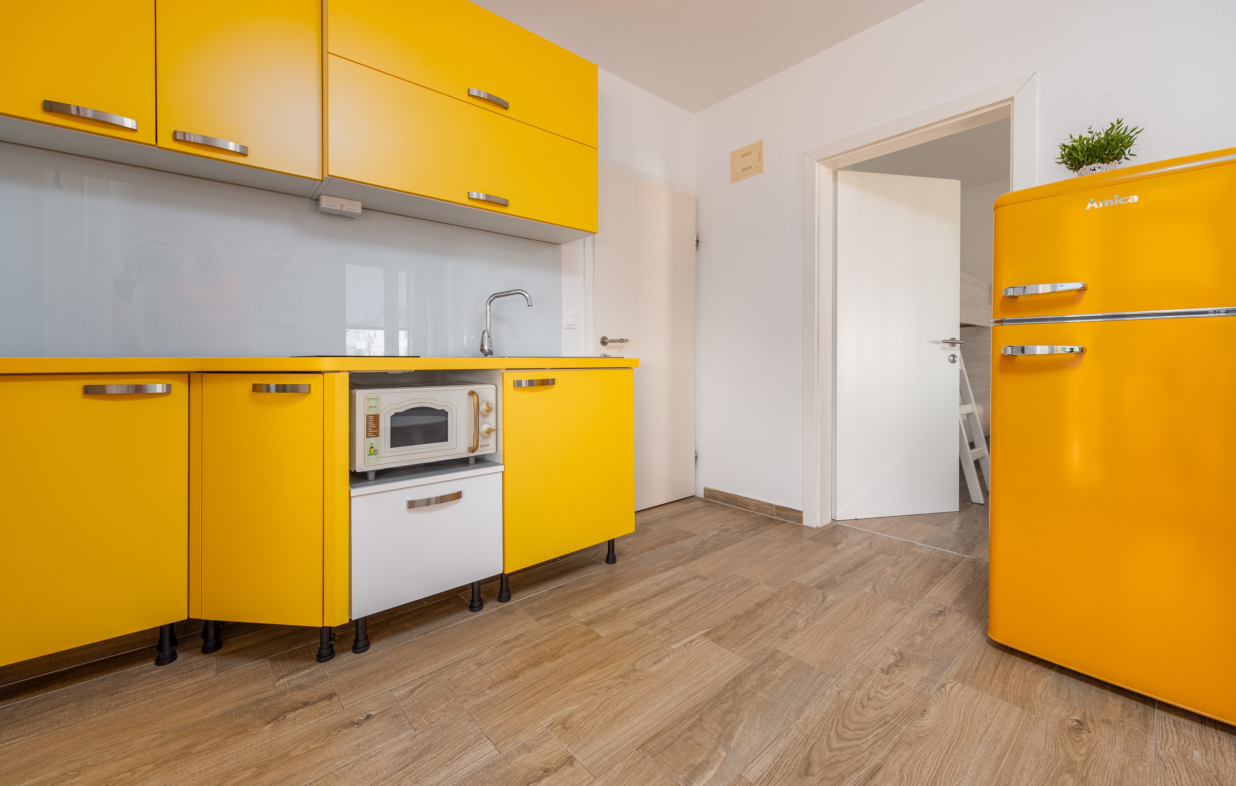 Kitchen with yellow cabinets and retro fridge, Apartment Yellow