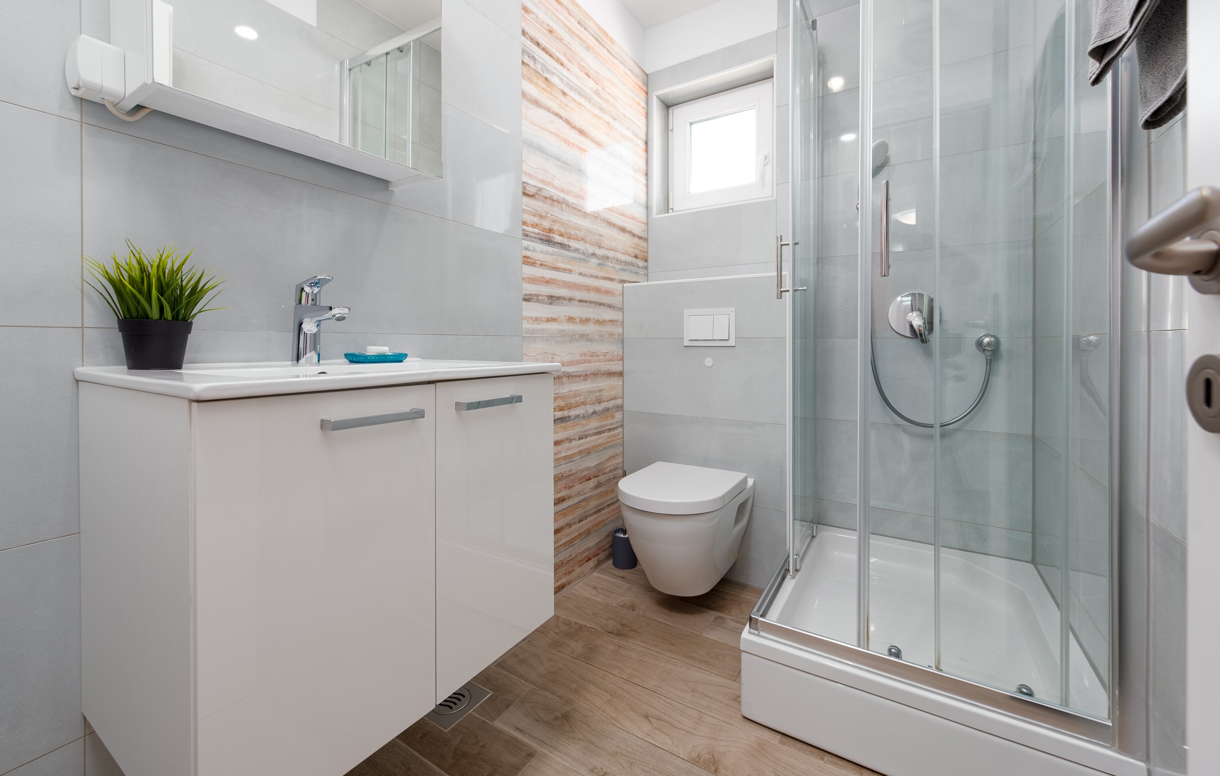 Bathroom with shower cabin and stone tiling, Apartment Blue