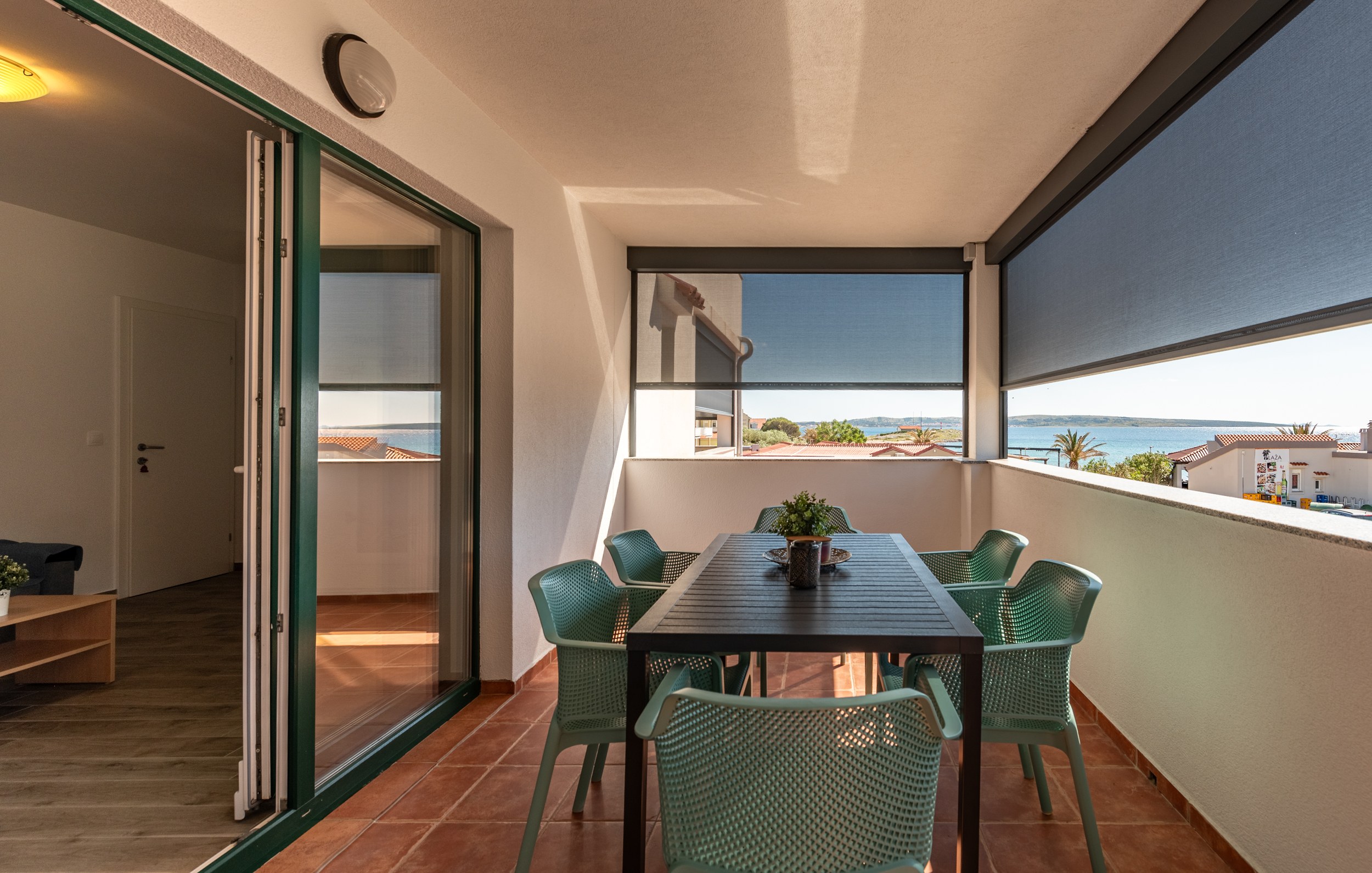 Terrace table for six beside the living room doors, Apartment Blue