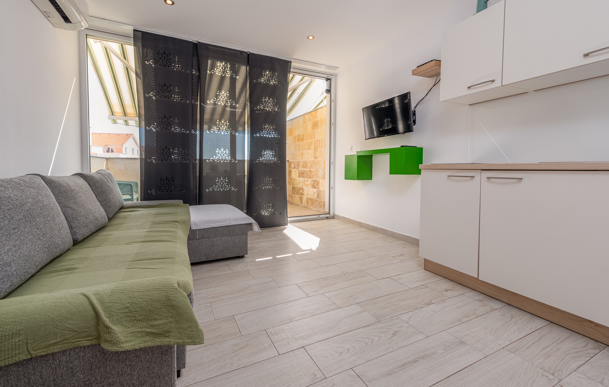 Living area with sofa bed and terrace door, Apartment Yellow