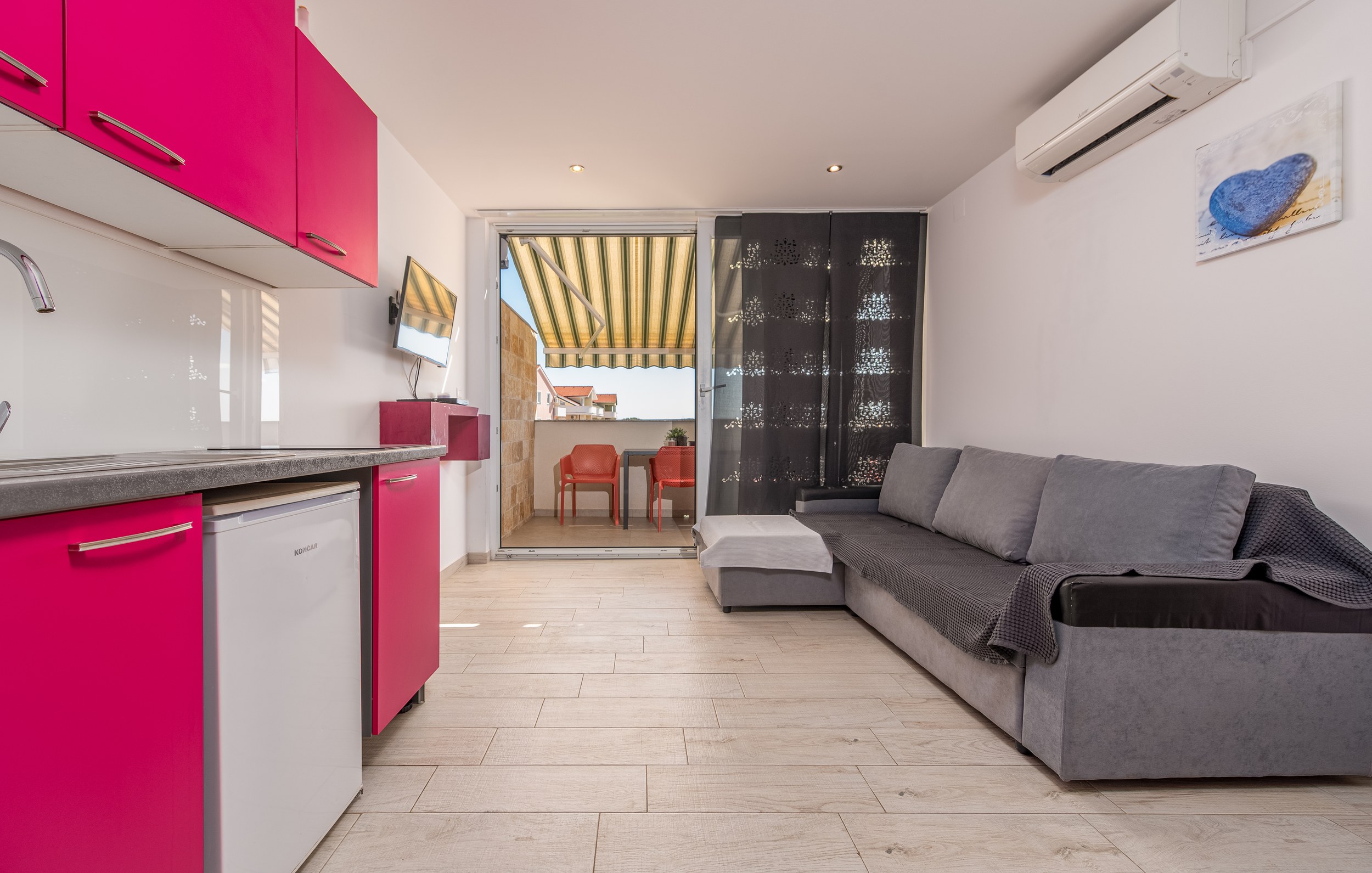 Living area with sofa bed and terrace door, Apartment Yellow
