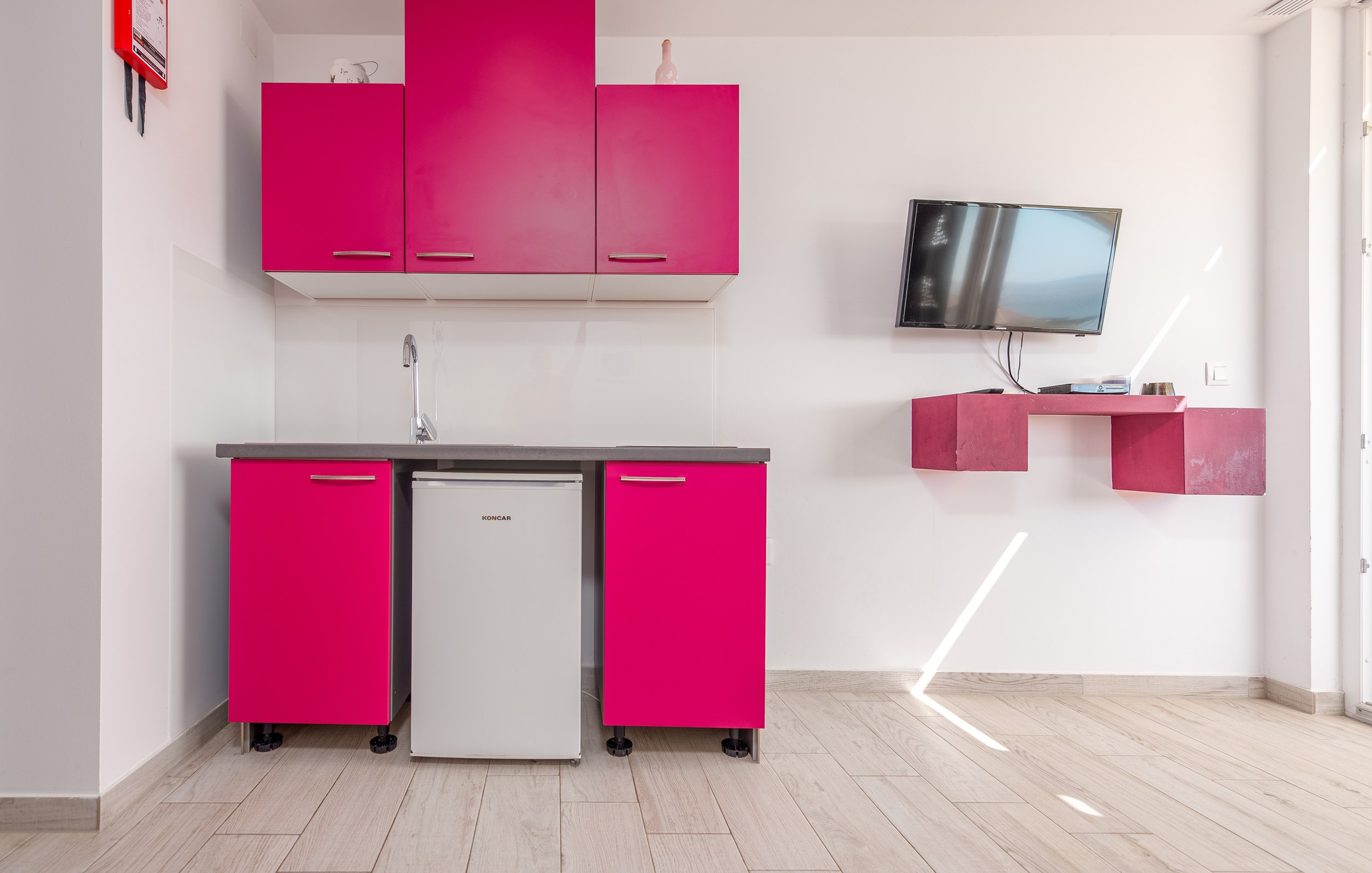 Kitchen with yellow cabinets and retro fridge, Apartment Yellow