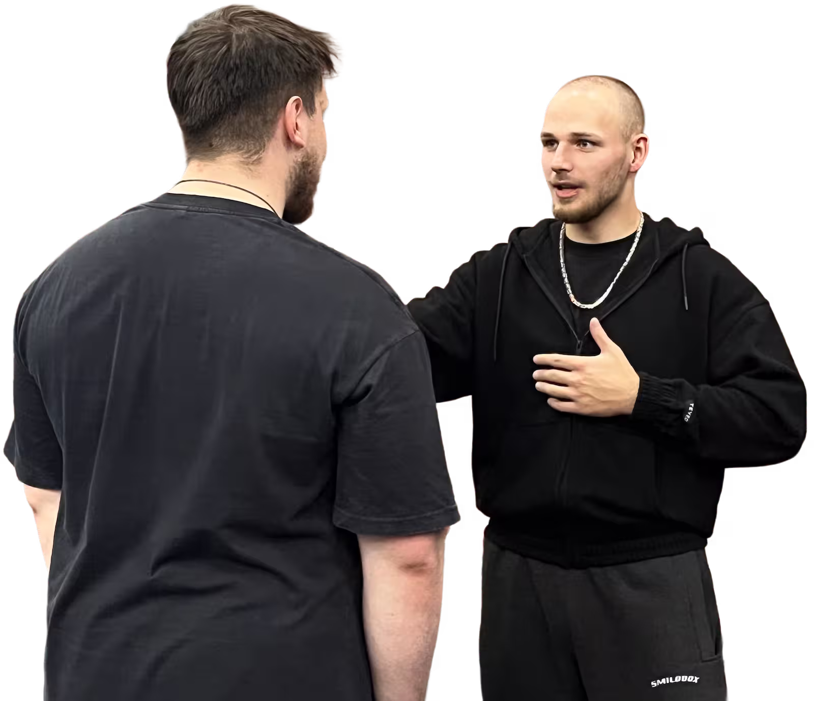 Coach Janick Derigs im Gespräch mit einem Coaching-Teilnehmer