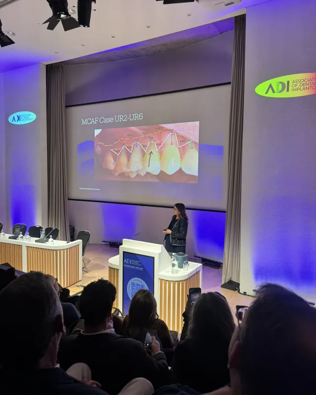 Dr Payvand Menhadji presenting a mucogingival surgery case at an ADI event