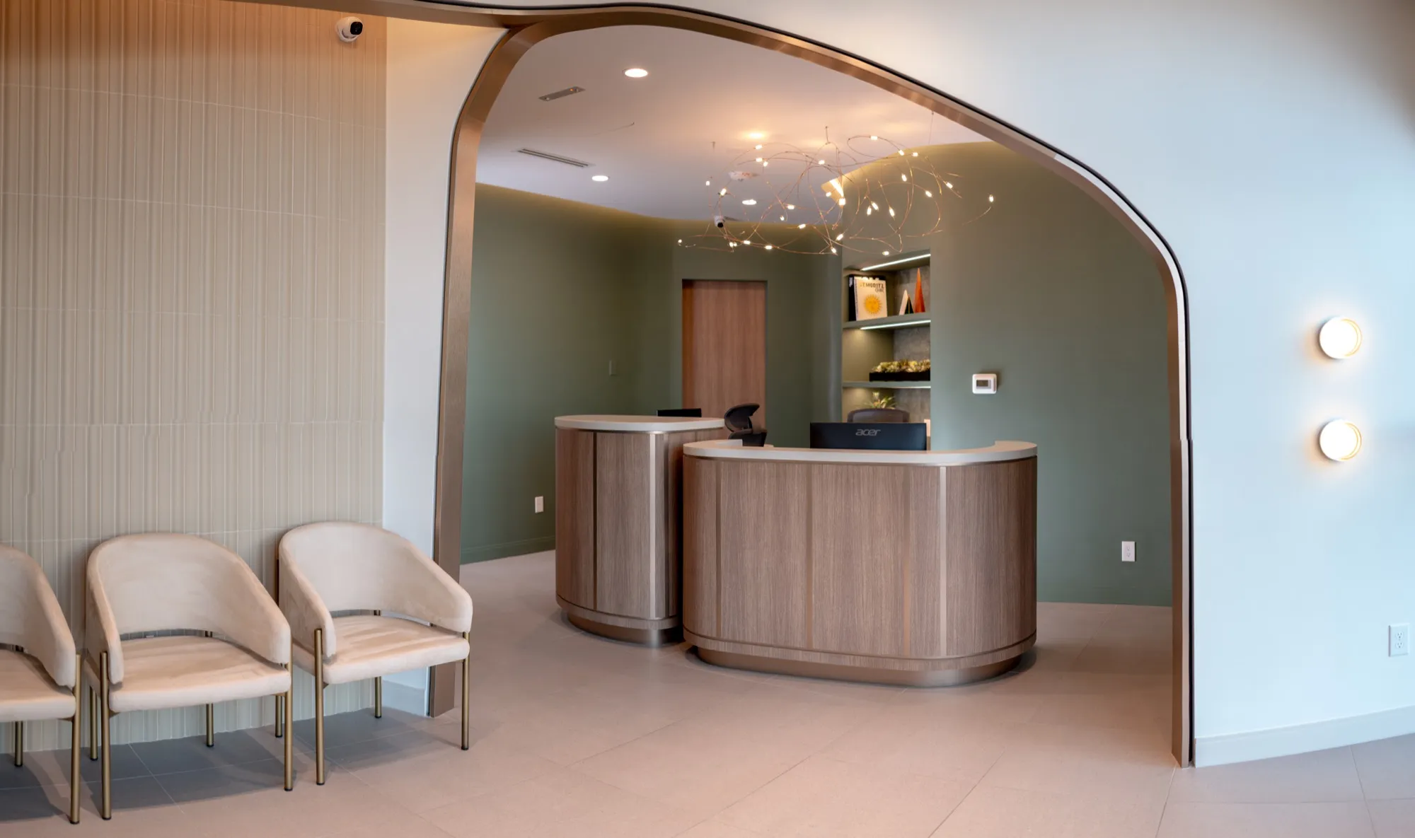 Curved reception desk and welcoming interior architecture at Springs Dental