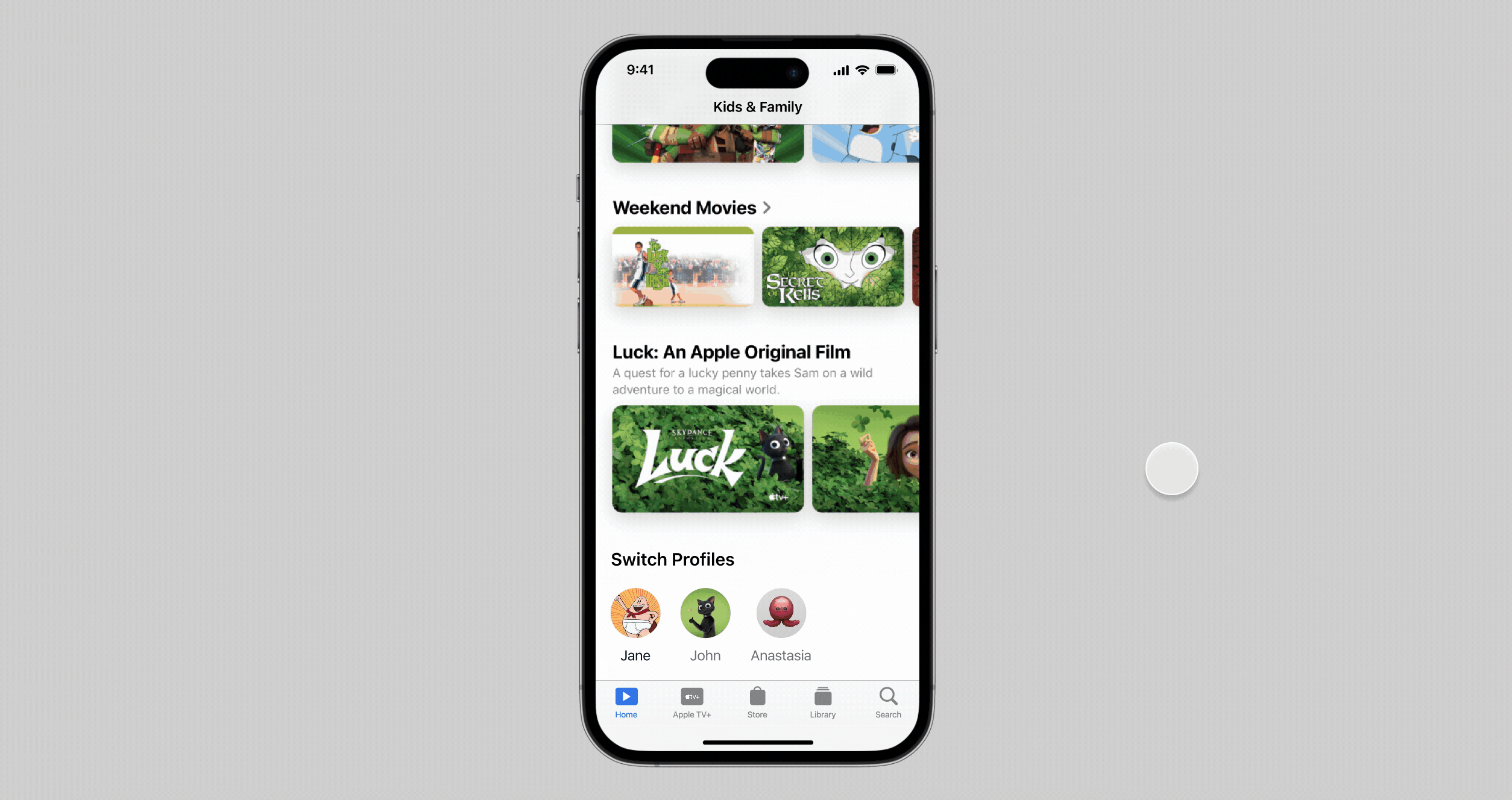iPhone screen showing Apple TV Kids & Family section with movies and profile switch icons.