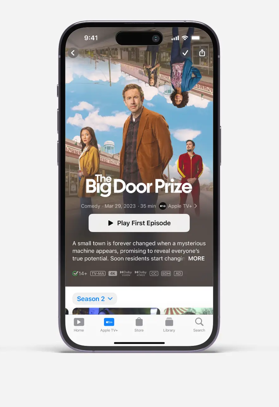 Apple TV+ screen on iPhone showing The Big Door Prize series with cast and play first episode button.