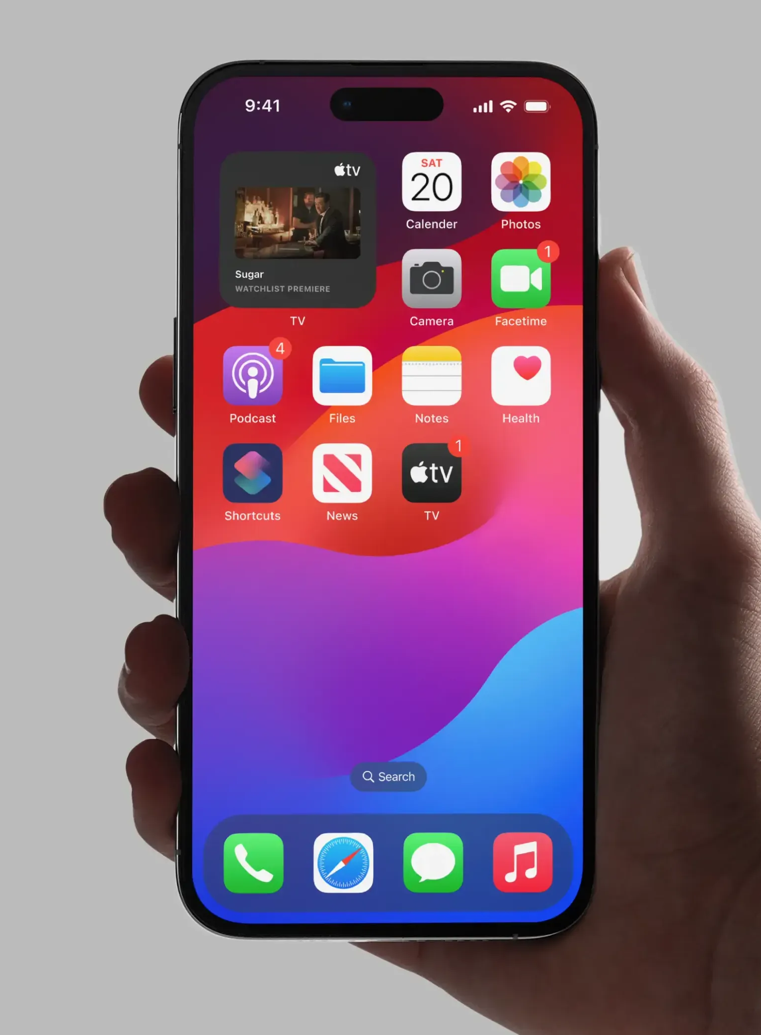 Hand holding smartphone displaying colorful home screen with app icons and notification badges.
