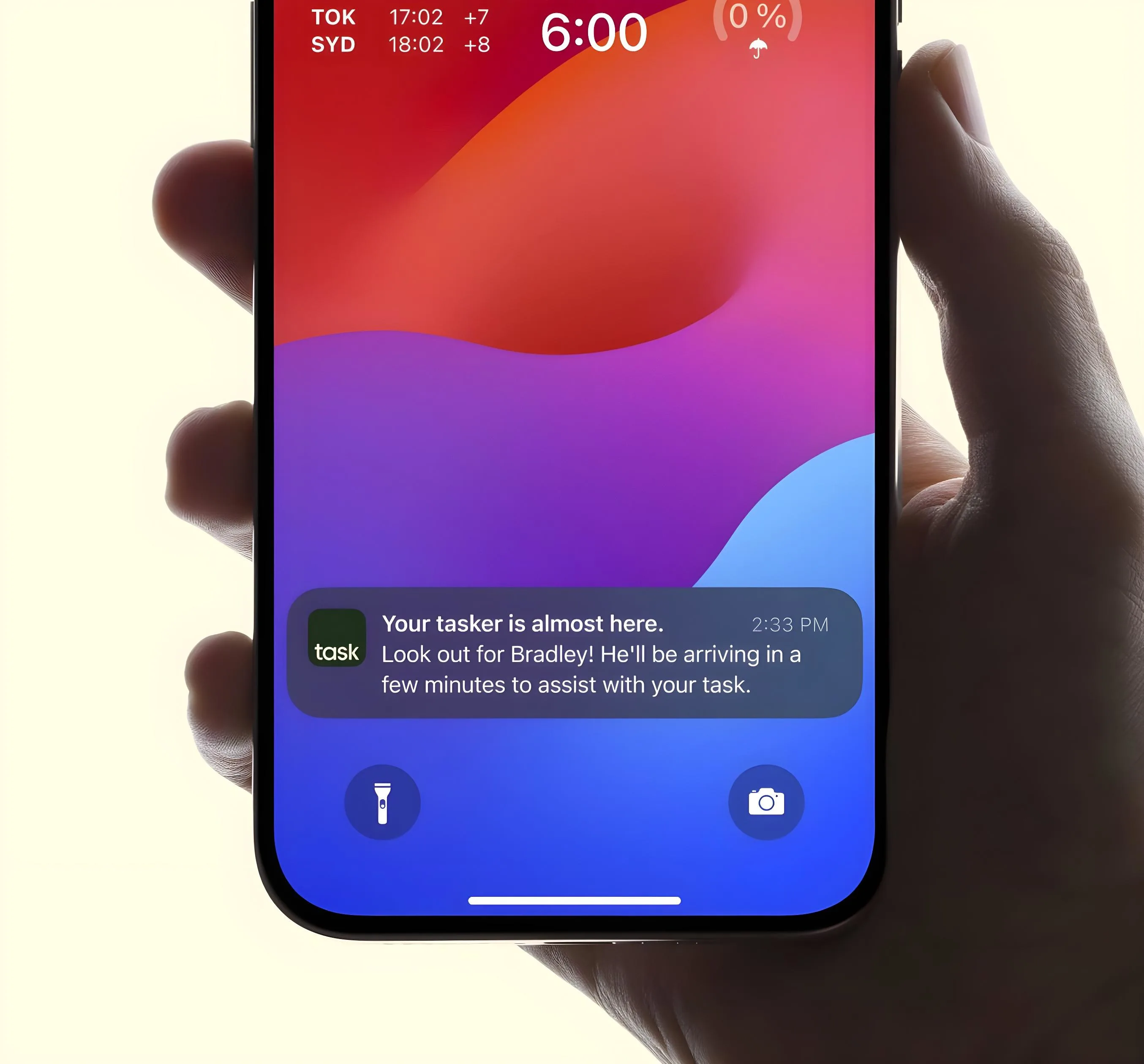 Phone screen showing a Taskrabbit notification about a tasker named Bradley arriving soon.