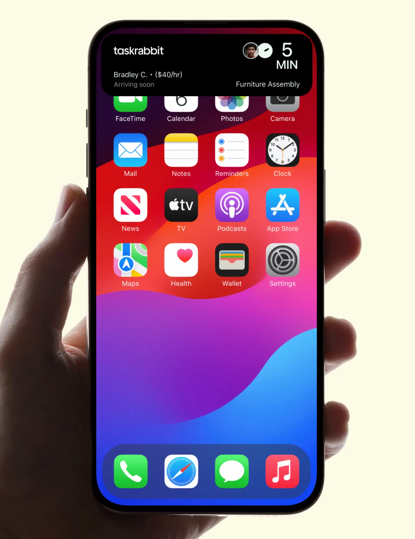 Hand holding smartphone with taskrabbit widget showing Bradley C. arriving soon for furniture assembly.