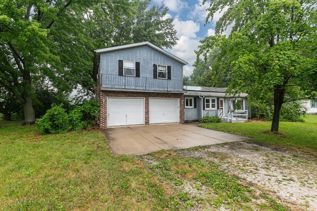 Half-Acre Wooded Lot, Solar Panels, Giant Garage. $94,900.