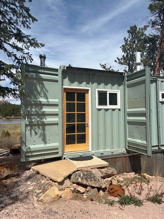 Solar-Powered Steel Container Cabin Near Nokomis Lake, Red Feather Lakes — $109,000