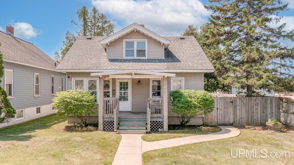 1919 Escanaba Home with Gas Fireplace and Detached Garage — $149,900