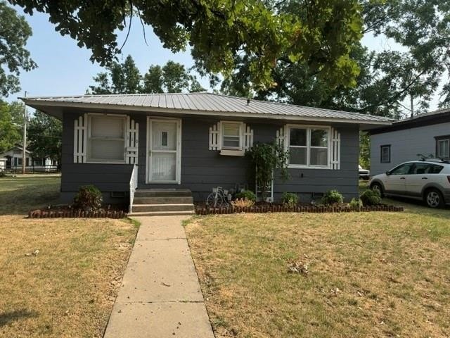 1900 Caney Bungalow with Hardwood Floors and a Big Backyard — $115,000