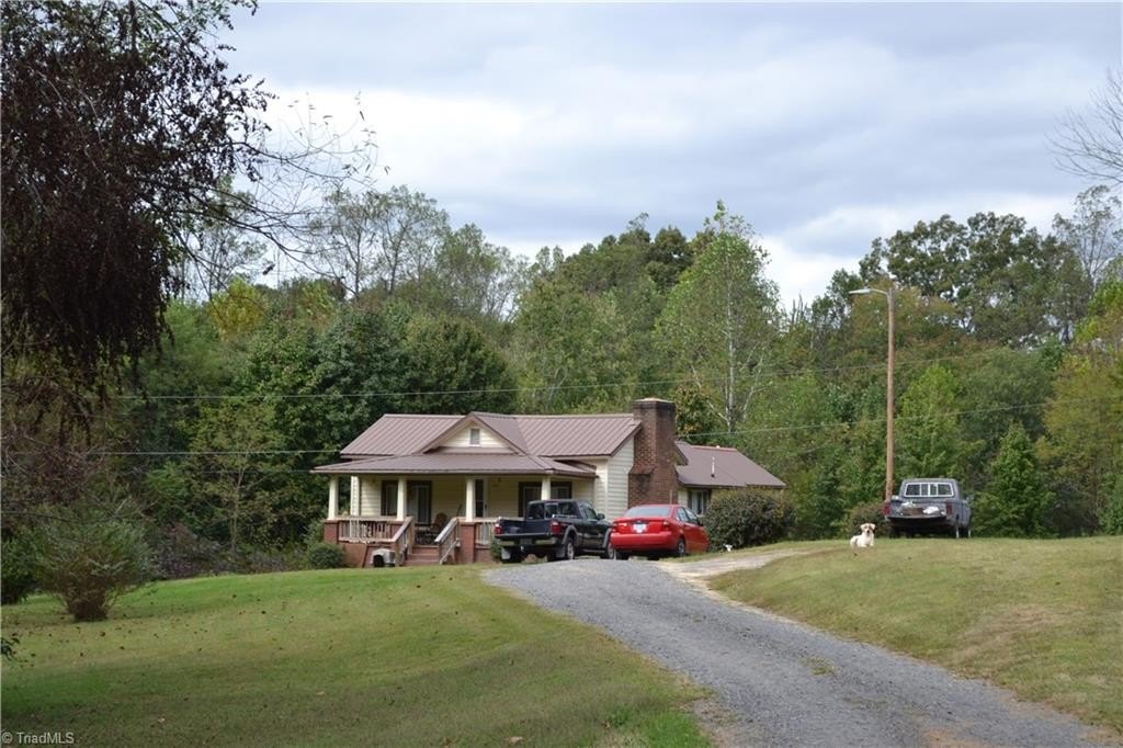 1917 Stoneville Farmhouse, 4+ Acres, Covered Porch, Metal Roof — $125,000