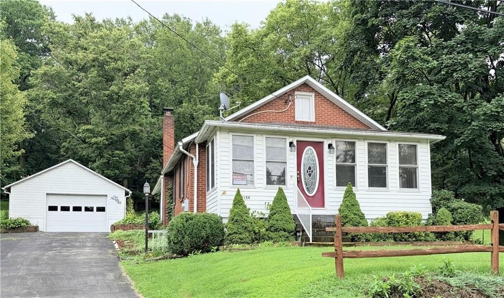 1946 Brick Ranch with 4-Car Detached Garage on Wooded Lot — $139,900