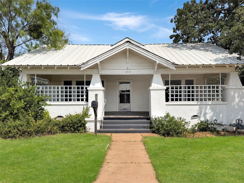 1920 Cisco House with French Doors, Built-ins, and a Two-Story Shop — $125,000