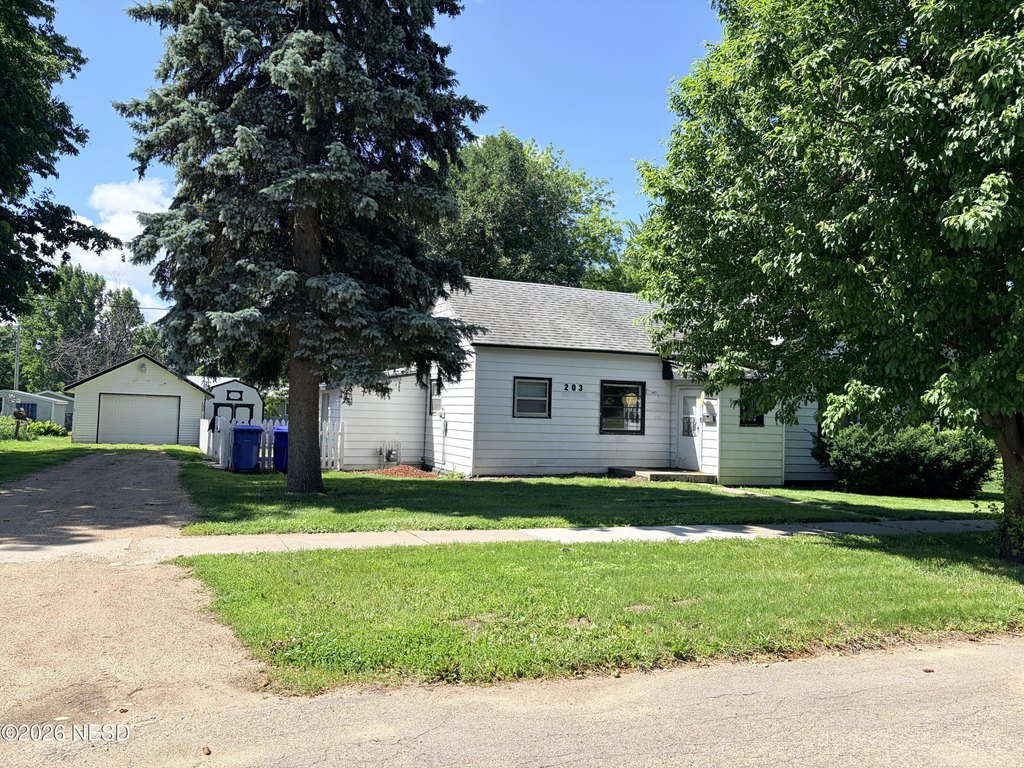 1920 Clark Home with Picket Fence, Garage, and New Shed — $115,000