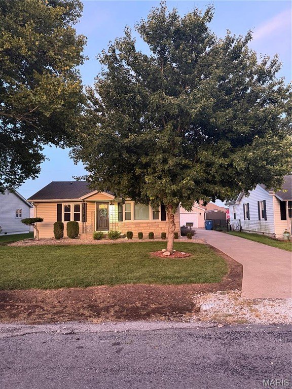 1960 Bethalto Bungalow with Hardwood Floors, Sunroom, and Heated Garage — $145,000