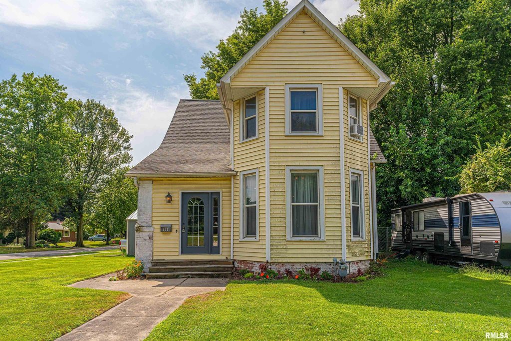 1879 Lincoln Corner Lot with Original Hardwood, Gas Fireplace, and Full Basement — $145,000