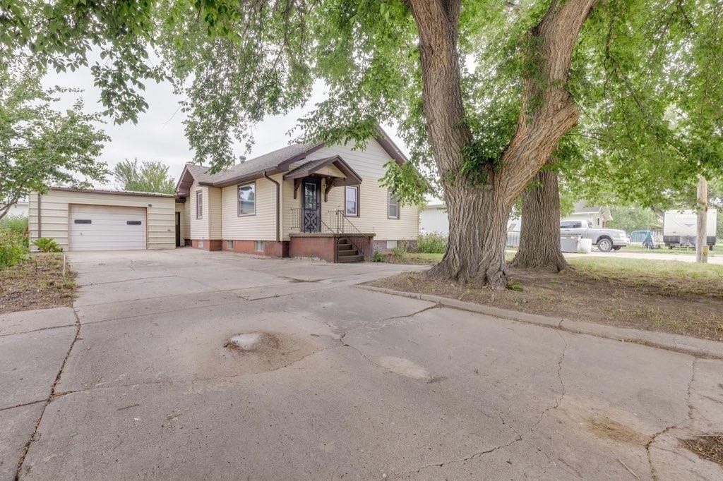1923 Nebraska Farmhouse on 12 Acres in Town — $129,000