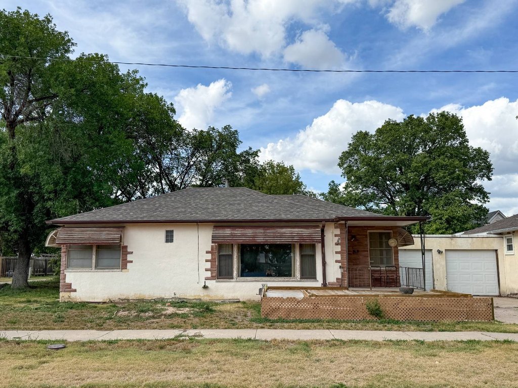 1948 Norton Stucco with Basement Apartment, Garage, and Covered Patio — $60,000