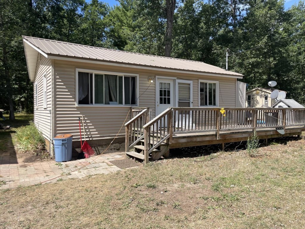Acre-plus Michigan Property Adjoining Federal Land, Big Garage — $149,900